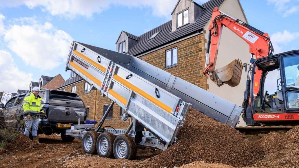 Brian James Twin axle tipper trailer carrying construction materials on site