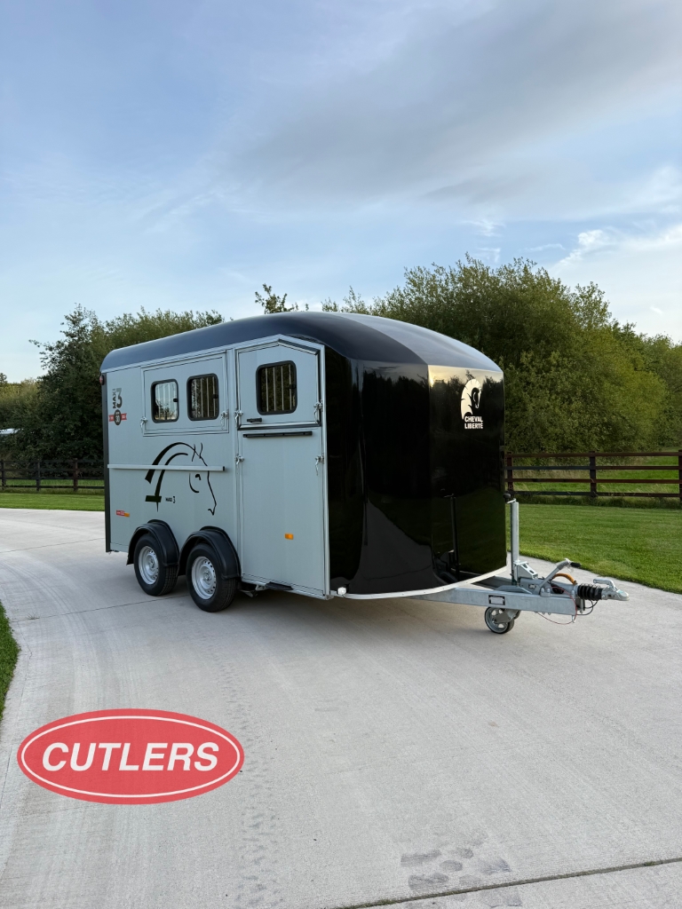 Side view of Cheval Liberté Maxi 3 horse trailer showing large body and triple horse layout