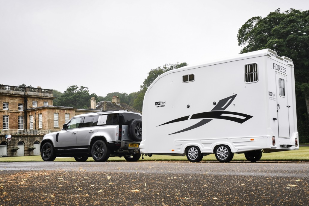 Equi Trek horse trailer being towed on road with enclosed body for safe horse transport