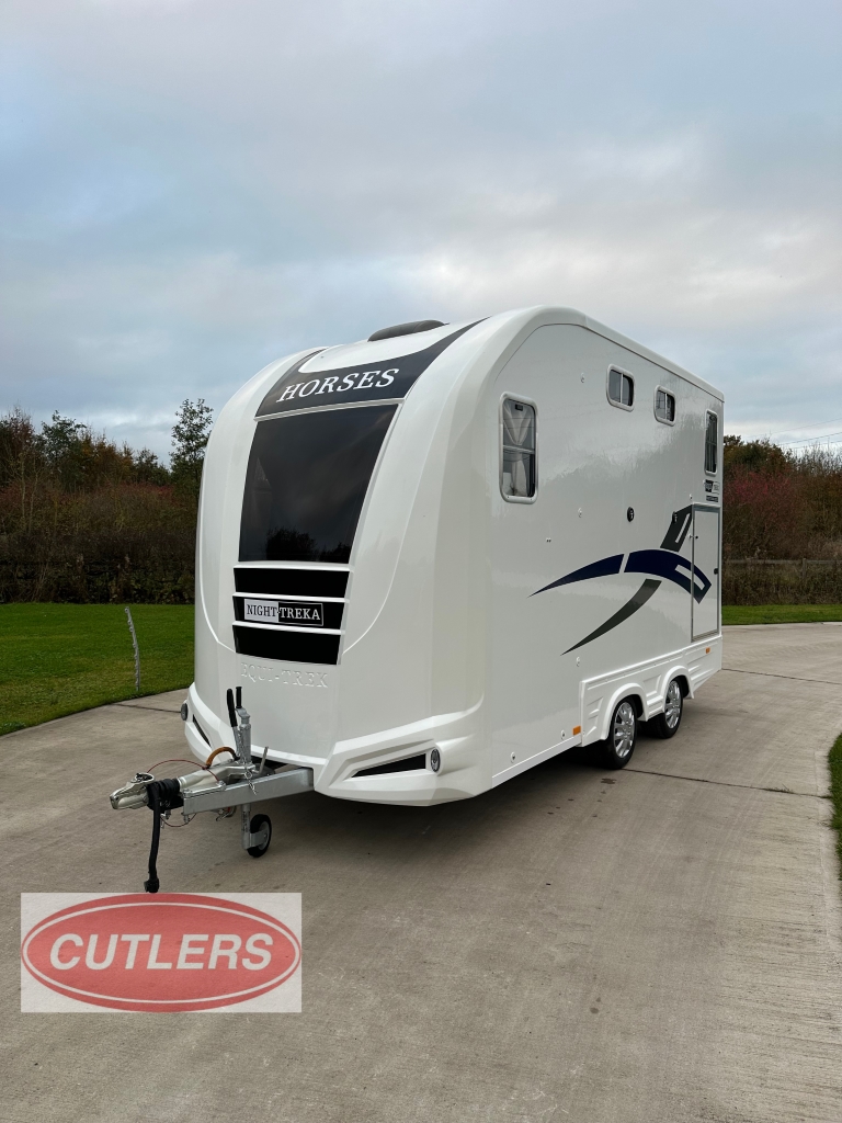 Equi-Trek Night Treka Excel front side angle showing aerodynamic nose and towing setup